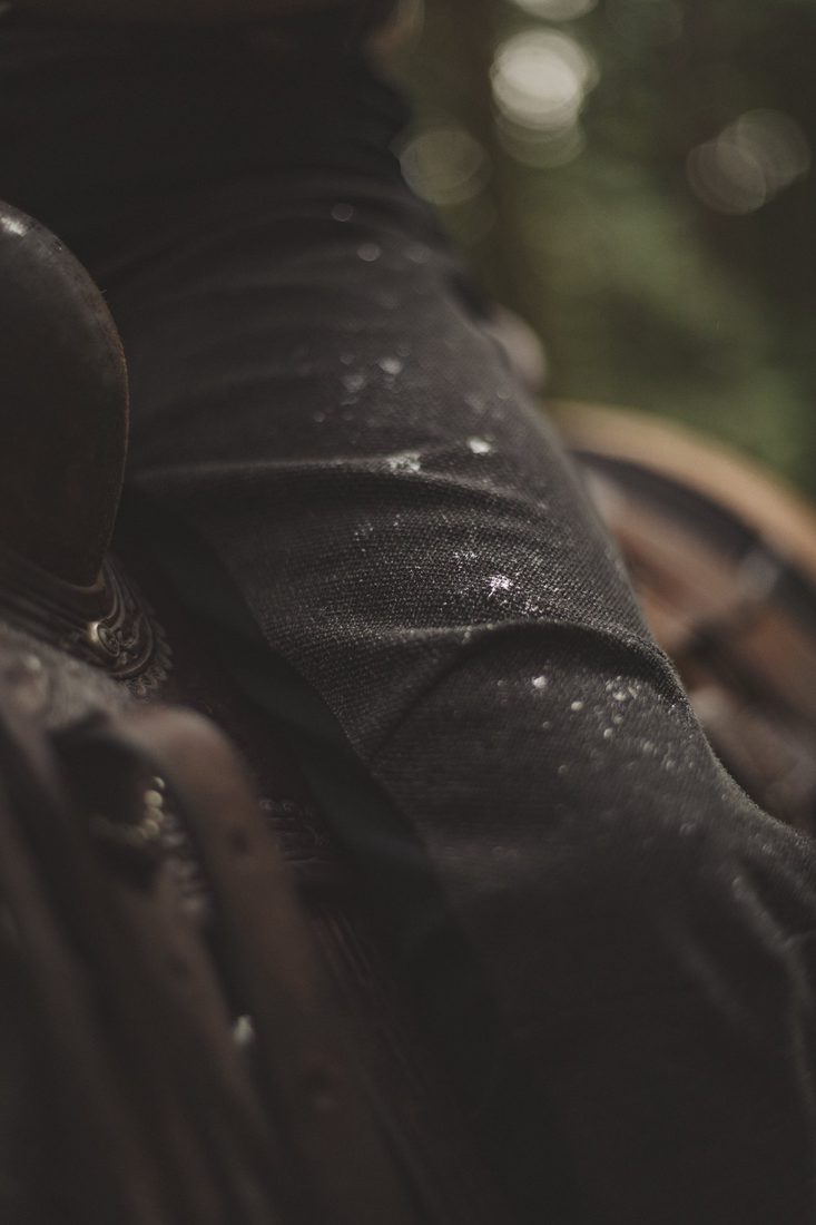 Close-up of rain beading on the Cordura thigh panel of The Bushwacker
